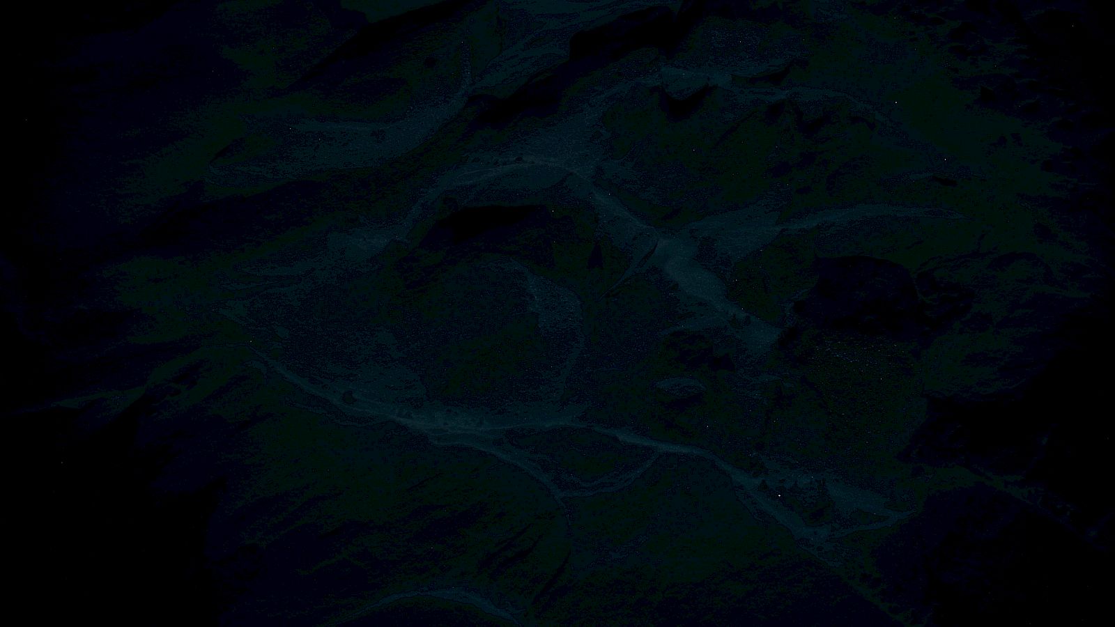 The image appears very dark and indistinct, making it difficult to discern specific details or subjects.